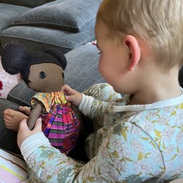 Happy little girl with her doll. Happy little girl with her doll.
