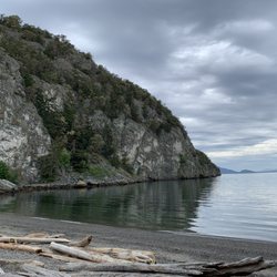 Watmough Bay - Rocky cliffs and calm water.