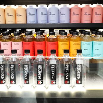 Organically Connected - a display of bottles of various flavored beverages - Vitamins & Supplements Near Me - Patchogue, New York