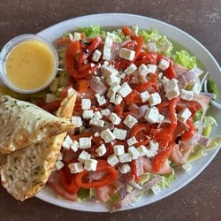 Pizza Boys - Greek salad with artichoke hearts substituted for kalamata olives; includes garlic bread.