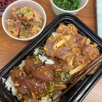 Poke By The Pound - One of the best bowls on the island! Half Garlic Ahi Poké and half Spicy Tuna with a side of their extra spicy special and ocean salad - Poke Near Me - Honolulu, Hawaii Poke By The Pound - One of the best bowls on the island! Half Garlic Ahi Poké and half Spicy Tuna with a side of their extra spicy special and ocean salad - Poke Near Me - Honolulu, Hawaii