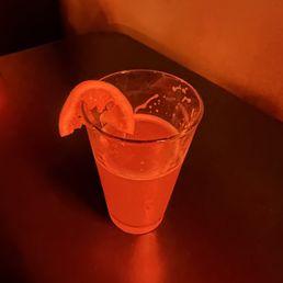 a drink with a slice of lemon