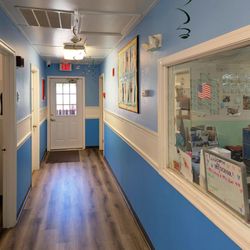 Callahan Learning Center - A bright hallway leading to classrooms at our Maple Grove child care center.