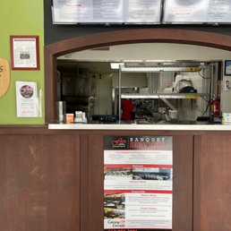 One of the employees making pizza