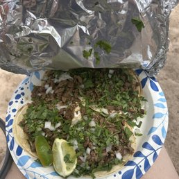 a person holding a plate of food