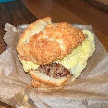 District Donuts Sliders & Brew - Biscuit with scrambled eggs cheese and turkey sausage - Donuts Near Me - New Orleans, Louisiana District Donuts Sliders & Brew - Biscuit with scrambled eggs cheese and turkey sausage - Donuts Near Me - New Orleans, Louisiana
