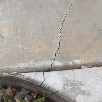 Isborn Concrete - The edge, you can see the crack goes through to the dirt - Masonry/Concrete Near Me Isborn Concrete - The edge, you can see the crack goes through to the dirt - Masonry/Concrete Near Me