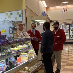 Market Basket - I reported this incident & the store mgr and assistant mgr for holding their face masks away from their faces as they talked to each other.