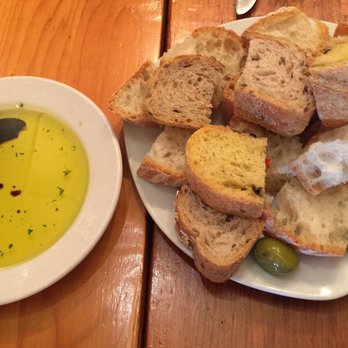 Rocco's Plum Tomato - A variety of bread and olives with olive oil and balsamic vinegar - Pizza Near Me - Etobicoke, Ontario Rocco's Plum Tomato - A variety of bread and olives with olive oil and balsamic vinegar - Pizza Near Me - Etobicoke, Ontario