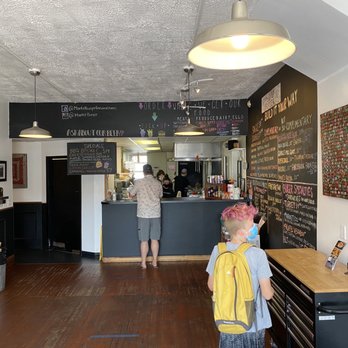 Market Burger - a man and a child in a restaurant - Burgers Near Me - Purcellville, Virginia Market Burger - a man and a child in a restaurant - Burgers Near Me - Purcellville, Virginia