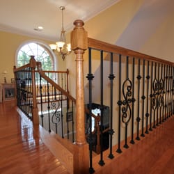 The Finishing Company - Scroll and Knuckle type iron balusters. Stair rail remodel in Richmond Va.