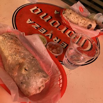 The Taco Stand - Two burritos in baskets on a table. - Mexican Near Me - Oceanside, California The Taco Stand - Two burritos in baskets on a table. - Mexican Near Me - Oceanside, California