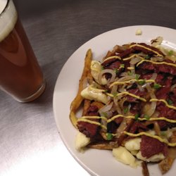Maudite Poutine - Smoked Meat Poutine and a beer.