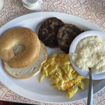 Starlite Diner - 2 egg scramble with American cheese, grits, sausage patties, and a bagel. - Diners Near Me - Daytona Beach, Florida Starlite Diner - 2 egg scramble with American cheese, grits, sausage patties, and a bagel. - Diners Near Me - Daytona Beach, Florida