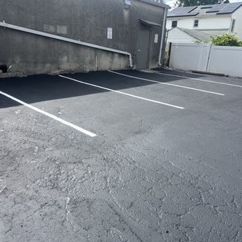 Back To Black Sealcoating - This is the finished job compared to the last photo where you just saw the cracks filled - Pressure Washers Near Me - Middlesex, New Jersey