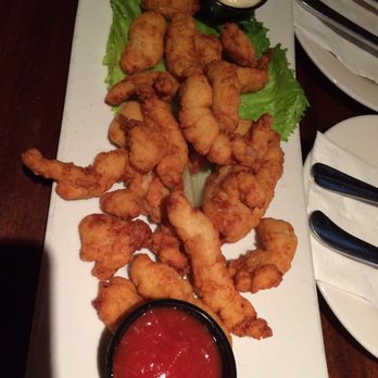 McGlynn's Pub & Restaurant - Clam strips ($8.99), crispy but no greasy-tasting and full of clam. - American Near Me - Dover, Delaware McGlynn's Pub & Restaurant - Clam strips ($8.99), crispy but no greasy-tasting and full of clam. - American Near Me - Dover, Delaware