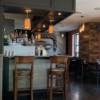 Buba Noodle Bar - a bar with wooden chairs - Ramen Near Me - Manchester, New Hampshire