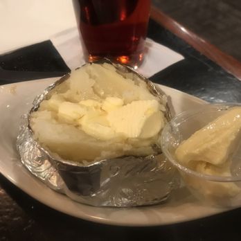 Starwood Restaurant & Pub - Steaming hot baked potato. Extra butter. Fluffy, really great - Pubs Near Me - New Castle, Pennsylvania