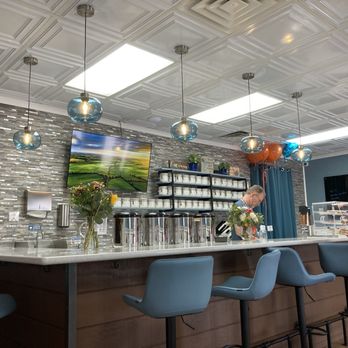 SereniTea Cup - Bar/ordering area. You can see all the loose leaf teas in canisters behind the counter - Tea Rooms Near Me - Cedar Park, Texas