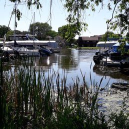 The boat is on the left in the far back.
