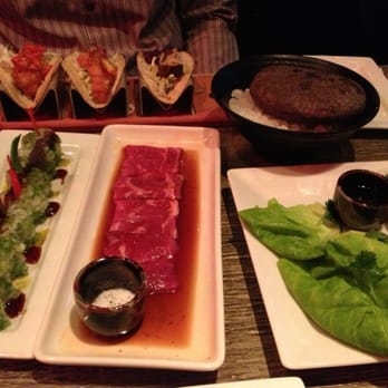 Tokio Pub - Crispy fish tacos, steak taco, tempura sweet potato roll and NY steak, about to be cooked on a hot stone. - Japanese Near Me - Schaumburg, Illinois Tokio Pub - Crispy fish tacos, steak taco, tempura sweet potato roll and NY steak, about to be cooked on a hot stone. - Japanese Near Me - Schaumburg, Illinois