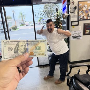 Good Times Barbershop - Happy customer playing darts after getting his ball taper! - Barbers Near Me - Fullerton, California