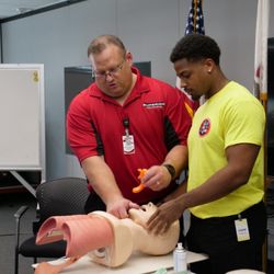 Superior Ambulance Service - EMT Instructor teaching an EMT student