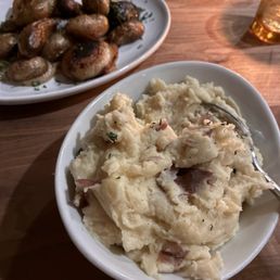 Mash potatoes with cheddar