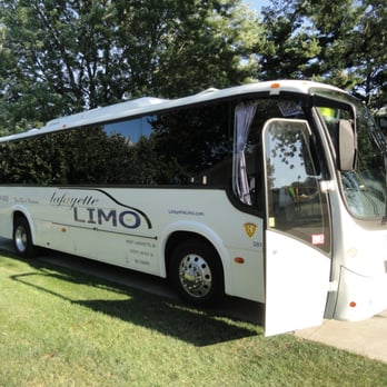 Lafayette Limo - One of our 41-passenger buses, parked outside and ready to pick you up! - Limos Near Me - Lafayette, Indiana Lafayette Limo - One of our 41-passenger buses, parked outside and ready to pick you up! - Limos Near Me - Lafayette, Indiana