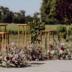 Visual Impact Design - Super windy day, so florals were put on the ground but it came out beautifully!