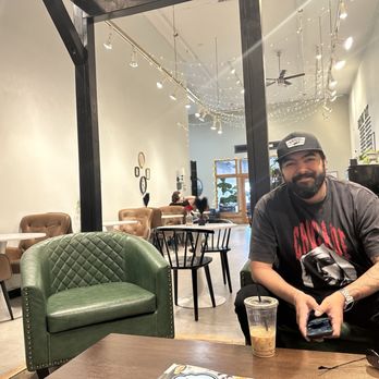 The Lonely Pine - My husband with his ganache mocha coffee. We are sitting in the kids area with our son. - Coffee & Tea Near Me - Grants Pass, Oregon The Lonely Pine - My husband with his ganache mocha coffee. We are sitting in the kids area with our son. - Coffee & Tea Near Me - Grants Pass, Oregon