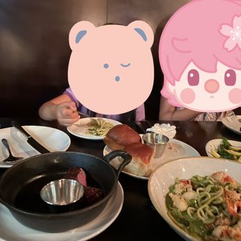 The Whalesbone - a girl eating a meal with a pig - Seafood Near Me - Ottawa, Ontario