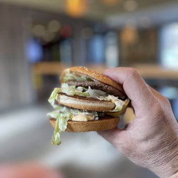 McDonald's - a hand holding a hamburger - Burgers Near Me - Montague, New Jersey