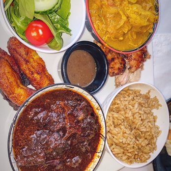 Yah Mon - Oxtails, curry chicken, rice, jerk 1/2 of a thigh, and a salad - Caribbean Near Me - Tampa, Florida Yah Mon - Oxtails, curry chicken, rice, jerk 1/2 of a thigh, and a salad - Caribbean Near Me - Tampa, Florida