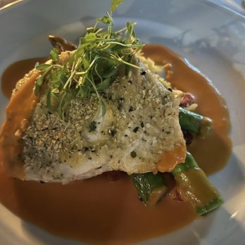 Copley's - roasted australian barramundi: herb scented farro, asparagus tips, smoky romesco sauce, roasted tomatoes = $37 - New American Near Me - Palm Springs, California Copley's - roasted australian barramundi: herb scented farro, asparagus tips, smoky romesco sauce, roasted tomatoes = $37 - New American Near Me - Palm Springs, California