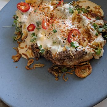 The Peached Tortilla - Beef Brisket Benedict with crispy shallots and slices of a fiery pepper - Asian Fusion Near Me - Austin, Texas The Peached Tortilla - Beef Brisket Benedict with crispy shallots and slices of a fiery pepper - Asian Fusion Near Me - Austin, Texas