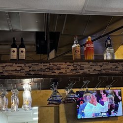 Los Cucos Mexican Cafe - Waco - This area was always the liquor stock. If you look closely the glasses seem dirty.