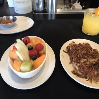 Nick's Manhattan Beach - Side of fruit salad Side of crispy hash browns Screwdriver with fresh squeezed OJ - American Near Me - Manhattan Beach, California Nick's Manhattan Beach - Side of fruit salad Side of crispy hash browns Screwdriver with fresh squeezed OJ - American Near Me - Manhattan Beach, California