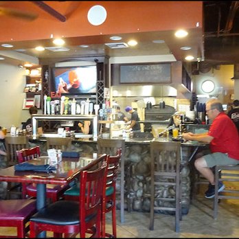 Primo Pizza - As you enter the restaurant, you'll notice the beer and wine bar, the open kitchen to the rear, and the tall tables, tall stools and tall ba - Pizza Near Me - Rocklin, California