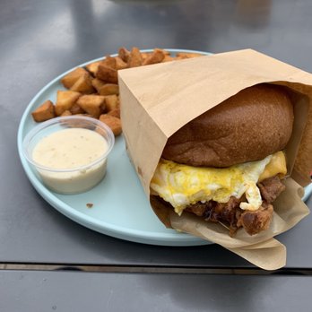 Burnt Crumbs - Steak and egg breakfast sandwich. It was ok and more like country fried chicken and egg sandwich. - New American Near Me - Irvine, California