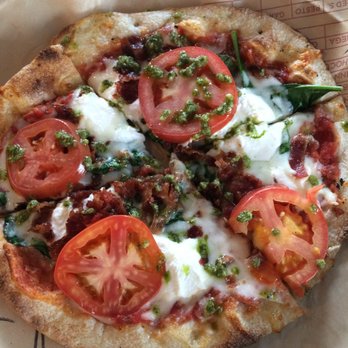 MOD Pizza - Mini pizza with red sauce, ricotta, mozzarella,tomato, bacon and a sprinkle of pesto - Fast Food Near Me - Newtown Square, Pennsylvania