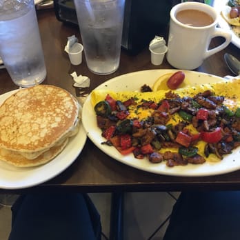 The Pancakery - The Atomic Bomblette, with a side of silver dollars. Note the the jalapeños in the omelette still had their seeds attached. Mighty spicy. - Breakfast & Brunch Near Me - Destin, Florida The Pancakery - The Atomic Bomblette, with a side of silver dollars. Note the the jalapeños in the omelette still had their seeds attached. Mighty spicy. - Breakfast & Brunch Near Me - Destin, Florida