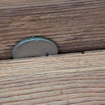 50Floor - Gaps in the stairs large enough to put a quarter and nickel on top of each other. - Flooring Near Me - Roswell, Georgia 50Floor - Gaps in the stairs large enough to put a quarter and nickel on top of each other. - Flooring Near Me - Roswell, Georgia