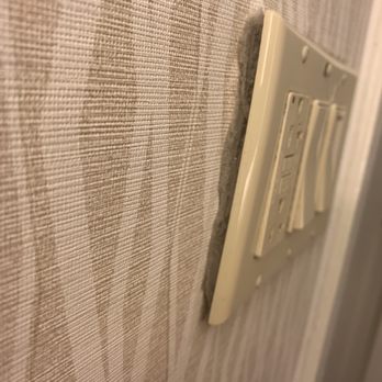 Marriott St. Louis Airport - Outlet pushing out of the wall. Big wad of dust behind it - Hotels Near Me - St. Louis, Missouri