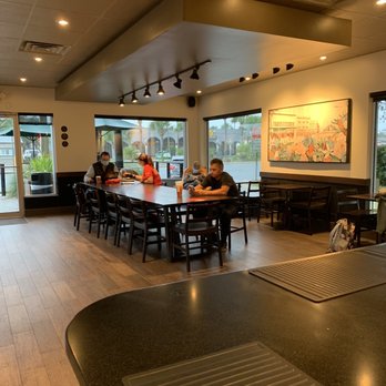 Starbucks - a group of people sitting at a table in a coffee shop - Coffee & Tea Near Me - Jacksonville Beach, Florida Starbucks - a group of people sitting at a table in a coffee shop - Coffee & Tea Near Me - Jacksonville Beach, Florida