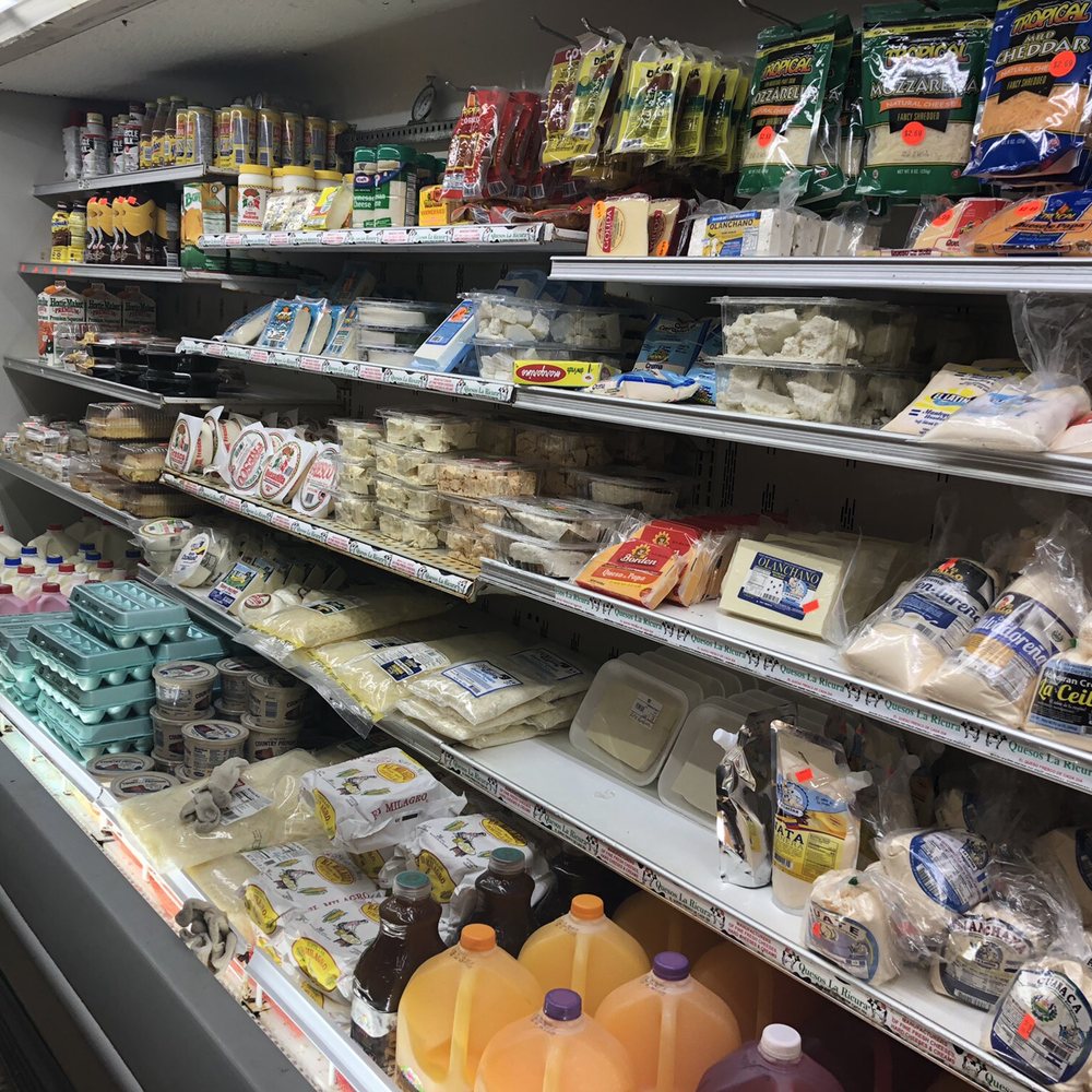 Deli Plus Grocery - a display of cheese and other foods - Grocery Near Me - Tampa, Florida