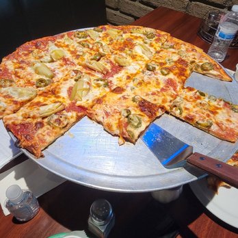 Romano's Chicago Pizzeria - Pizza with pepperoni,garlic,Canadian bacon,jalapeños, and artichoke. - Pizza Near Me - Riverside, California