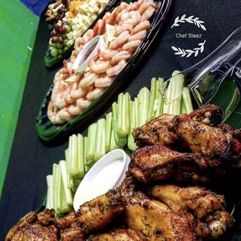Steez Catering - chicken wings, celery, and salad - Caterers Near Me