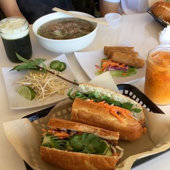 Pho Please - Pork banh mi (bigger than my head!), pho, eggrolls and thai tea and green tea. SALIVATING JUST LOOKING AT THIS - Vietnamese Near Me - Austin, Texas