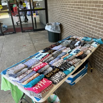 Ques Catering and Backyard BBQ - a table full of t - shirts - Caterers Near Me - Sevierville, Tennessee Ques Catering and Backyard BBQ - a table full of t - shirts - Caterers Near Me - Sevierville, Tennessee